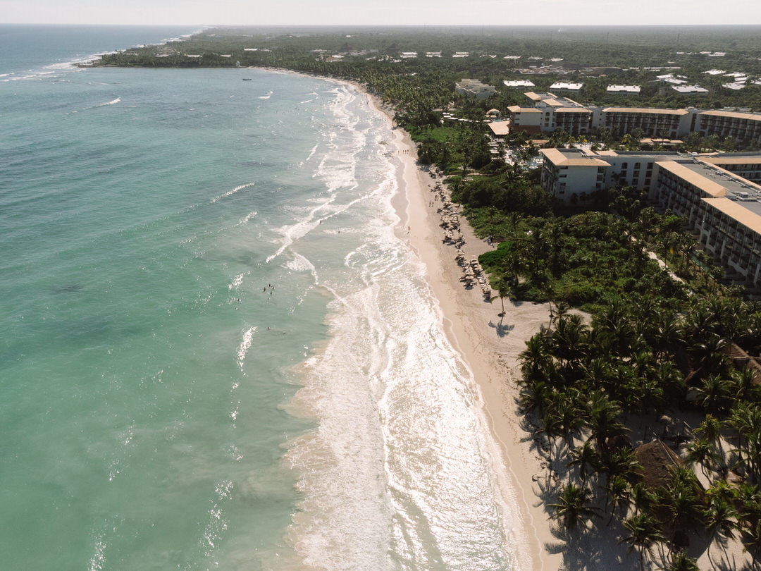 Aerial view of a stunning beach in Riviera Maya, captured by luxury destination wedding photographer Antonio Ojeda.