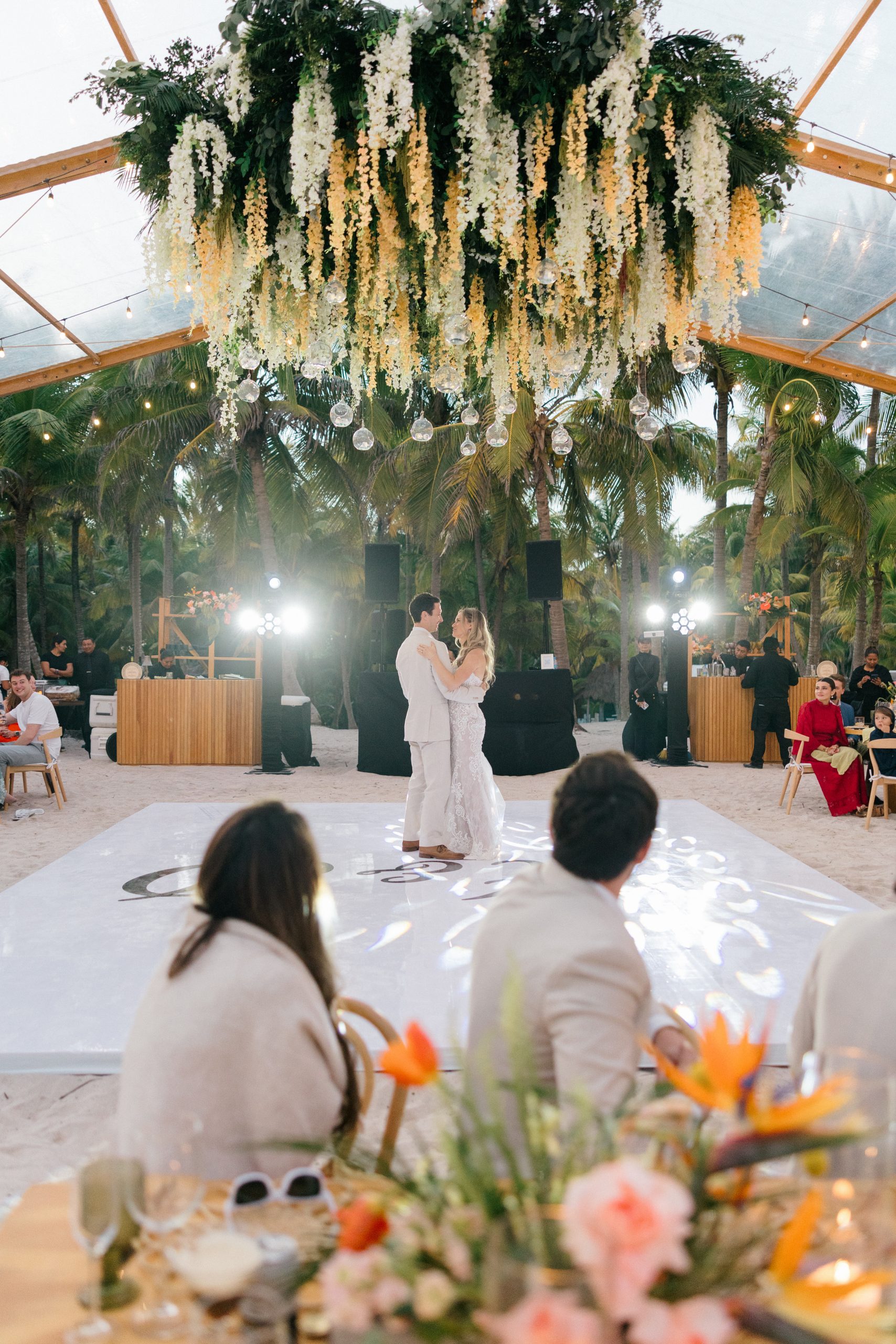 First dance under string lights beachfront reception Saasil Kantenah wedding