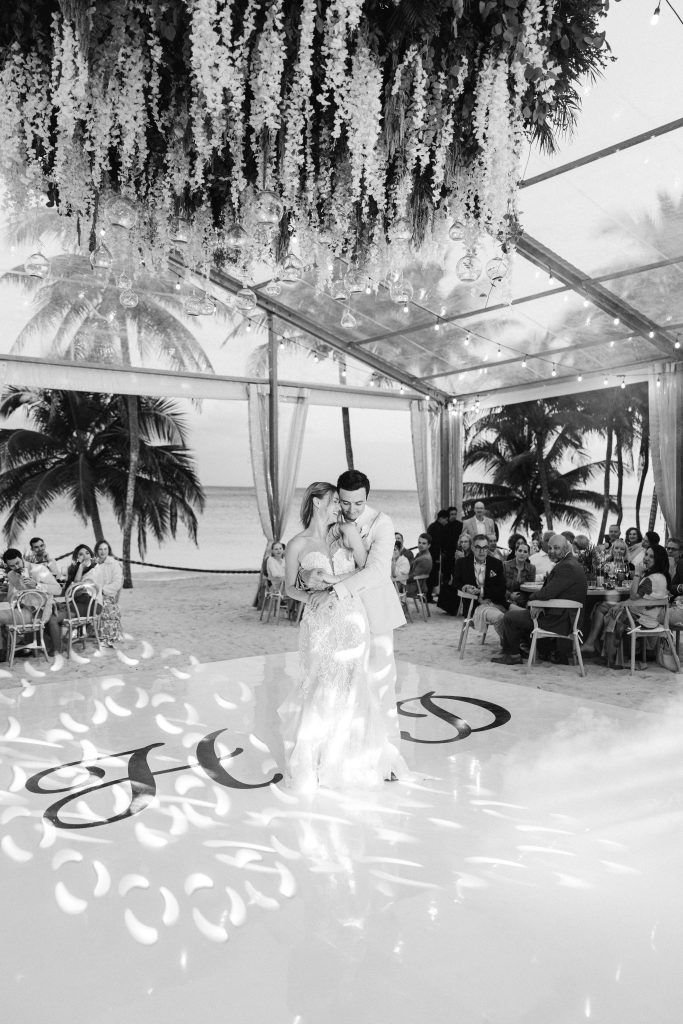 Bride and groom first kiss at beachfront wedding ceremony Saasil Kantenah