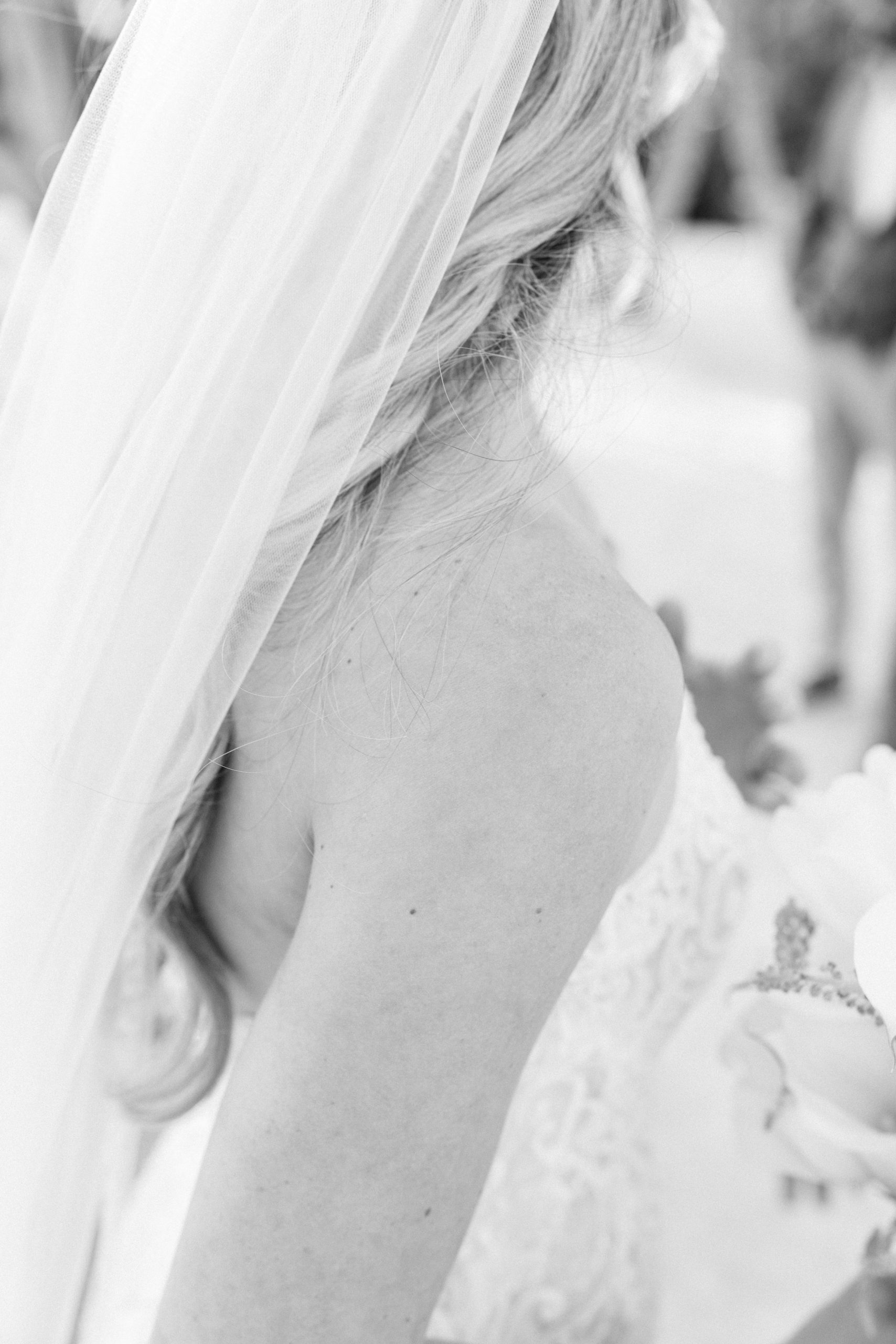 Maid of honour hugging bride before Playa del Carmen beach wedding
