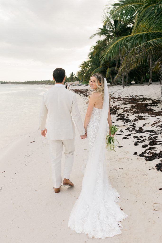 Bride and groom sunset photos Caribbean beach Riviera Maya wedding photographer