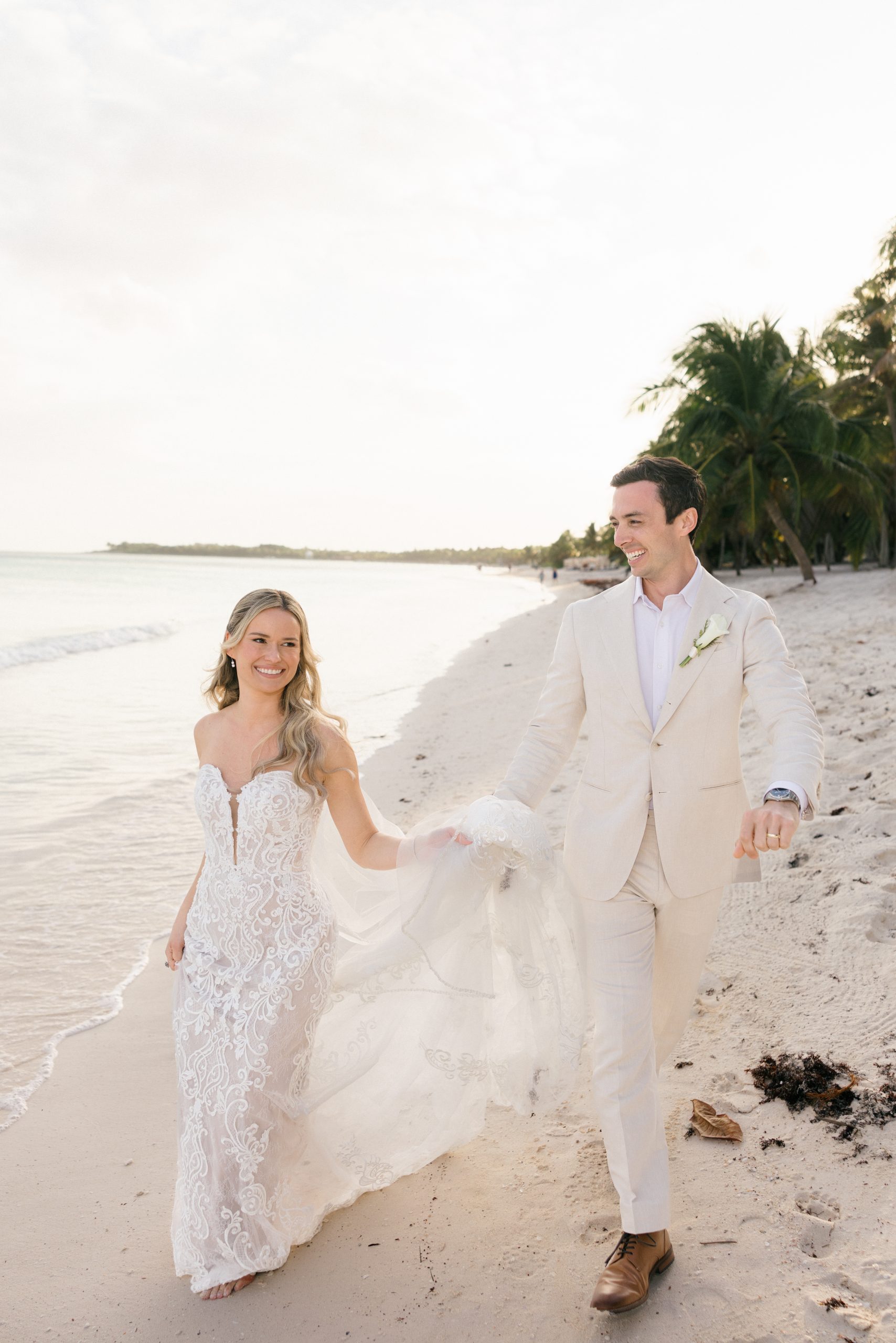 Bride and groom sunset photos Caribbean beach Riviera Maya wedding photographer