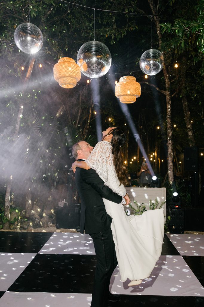 Night reception at Kima Tulum, candlelight through jungle canopy