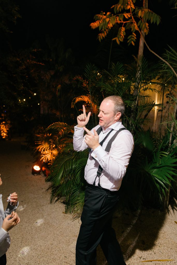 Candid moment of bride and groom sharing a laugh at Kima Tulum