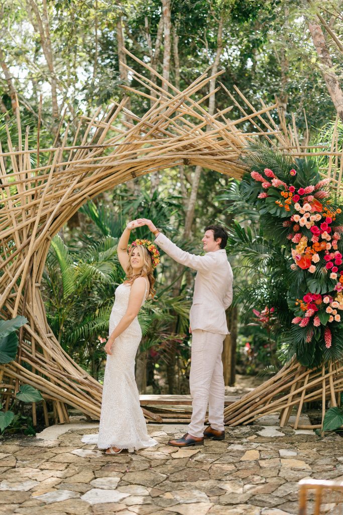 wedding at Espacio Chechén, bride and groom dancing on the circular wooden deck surrounded by jungle