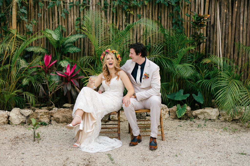 Bride and groom laughing together during cocktail hour at Espacio Chechén