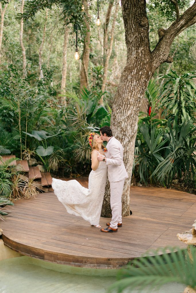 wedding at Espacio Chechén, bride and groom dancing on the circular wooden deck surrounded by jungle