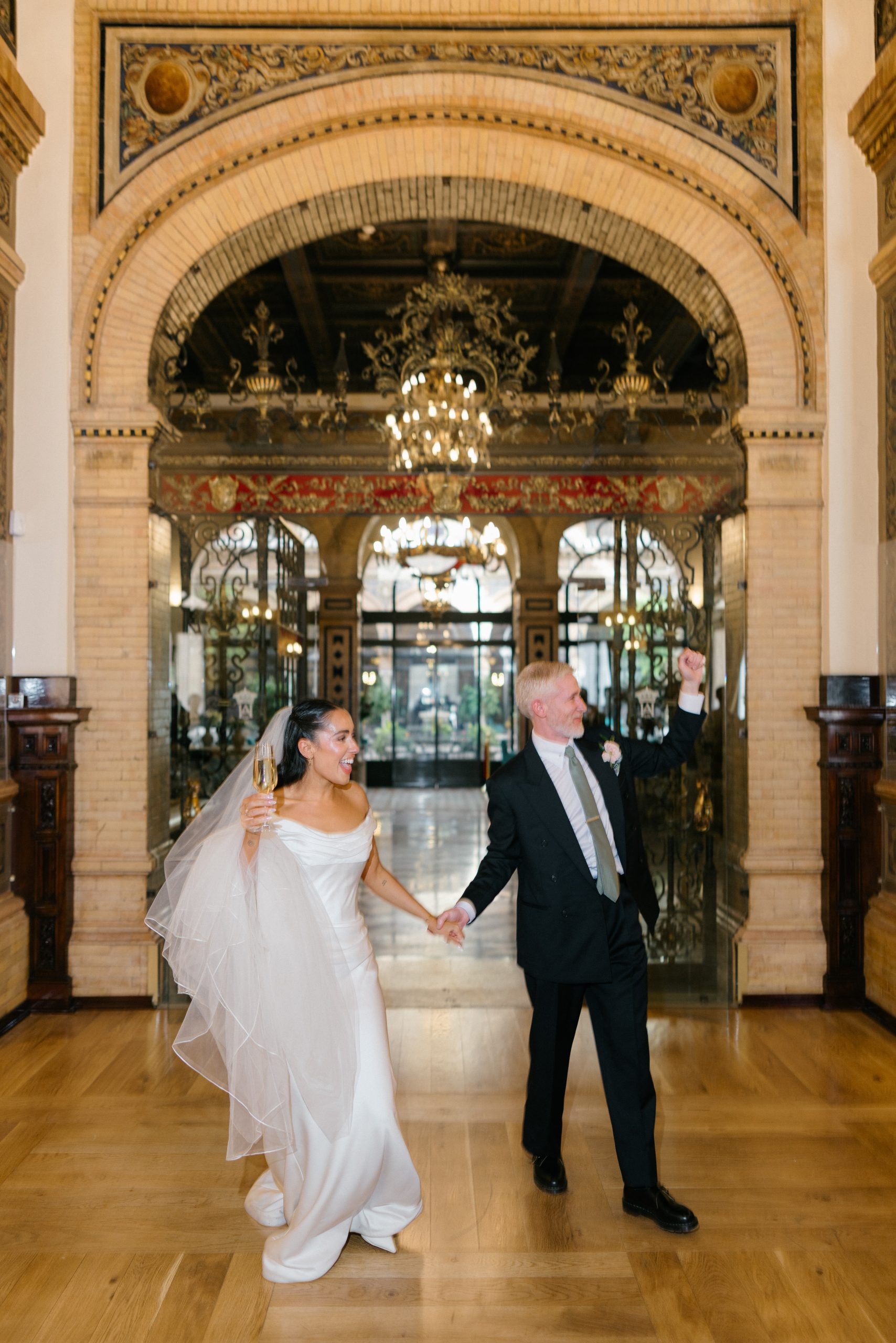 Bride and groom at Hotel Alfonso XIII Seville entrance